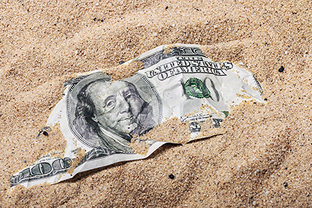 Dollar-Bill-Buried-In-The-Sand